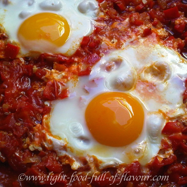 Turkish menemen with spiced tomatoes and peppers.