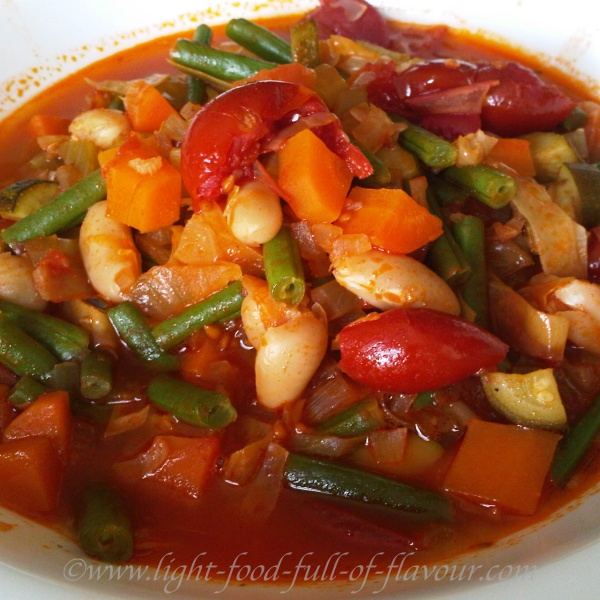 Minestrone soup with Parmesan cheese.