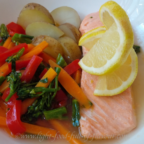 Poached salmon and vegetables with new potatoes.